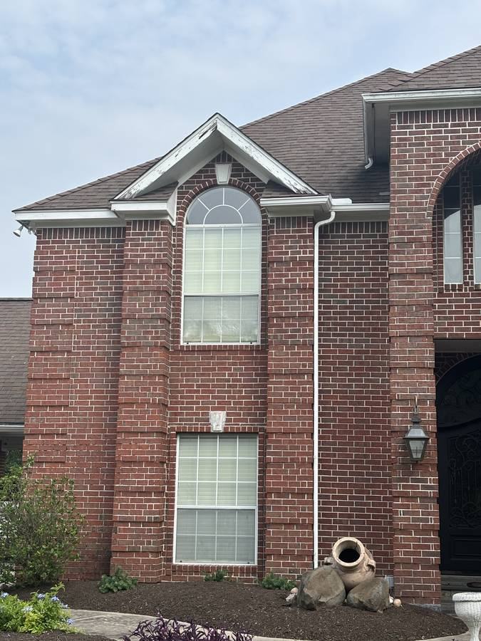 Gable trim before — peeling paint