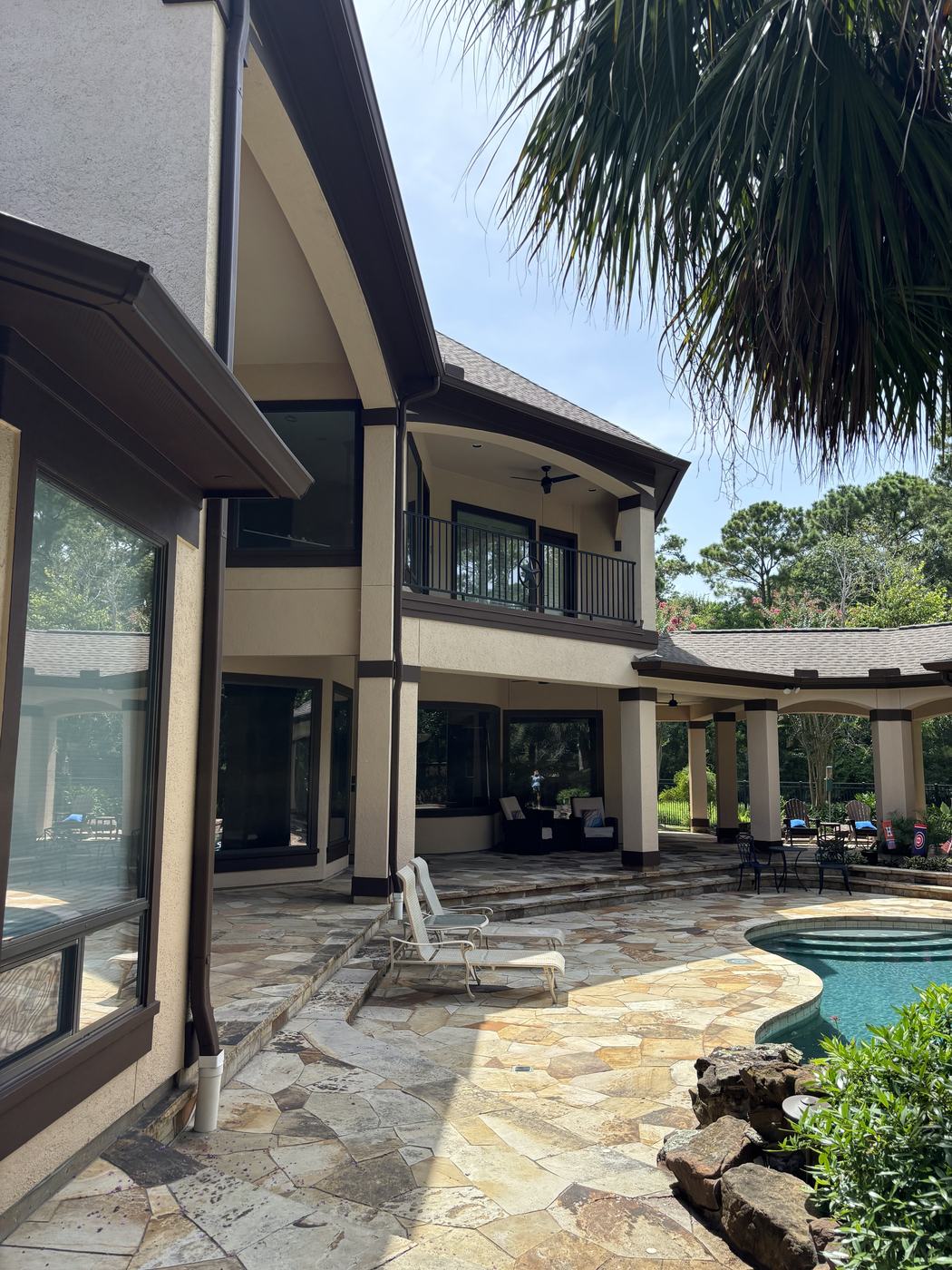 Finished exterior paint — stucco home by the pool