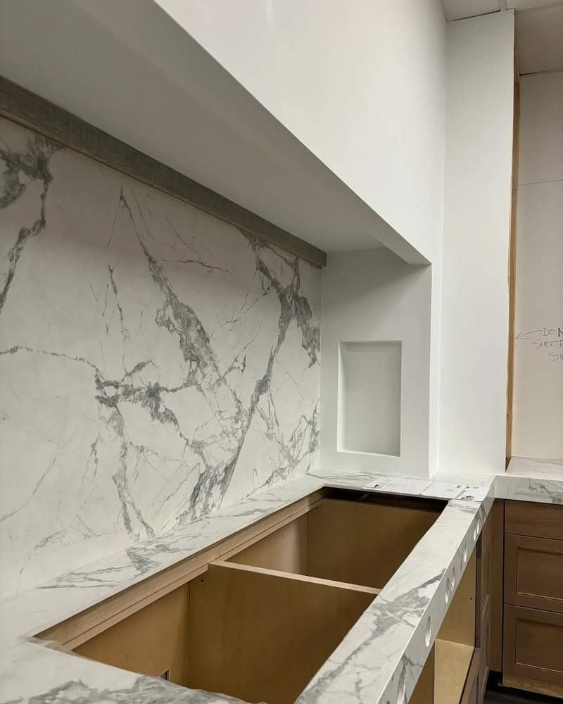 Marble countertop and backsplash installation in progress