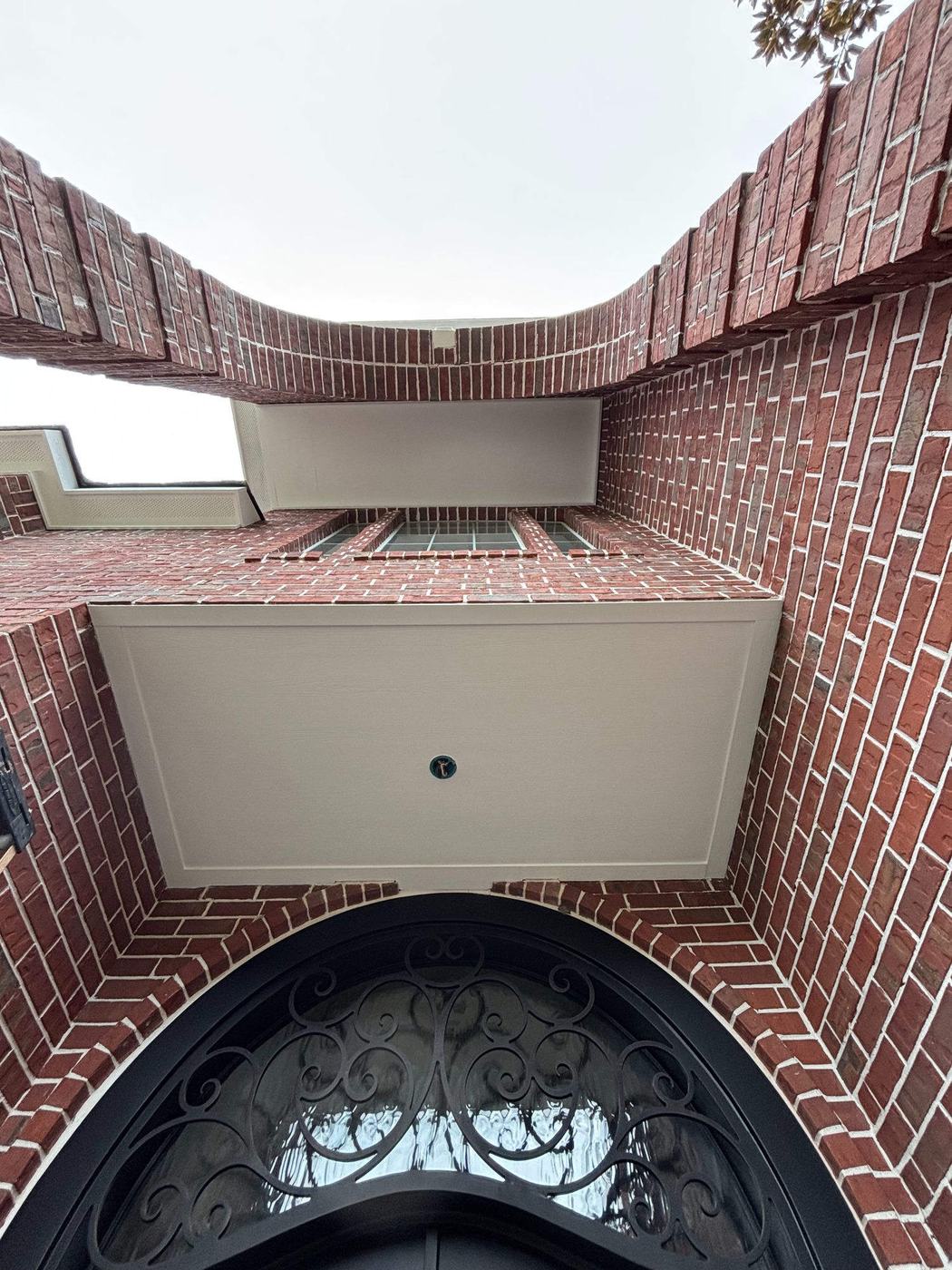 Exterior trim — finished soffit box at arched entry