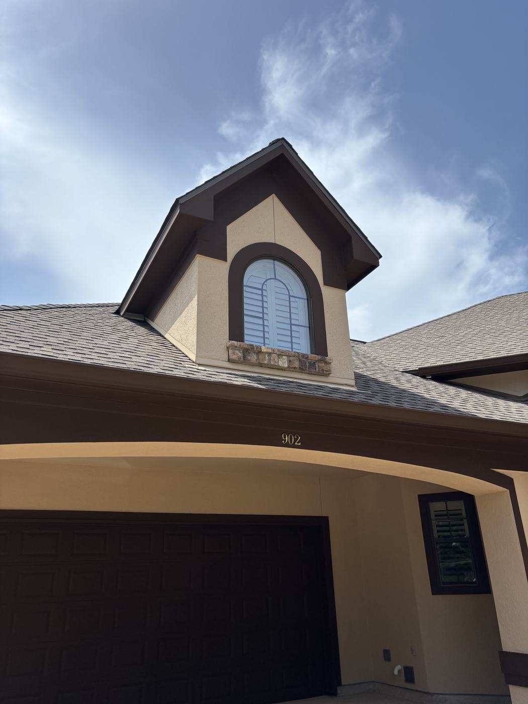 Exterior paint finished — dormer with new brown trim