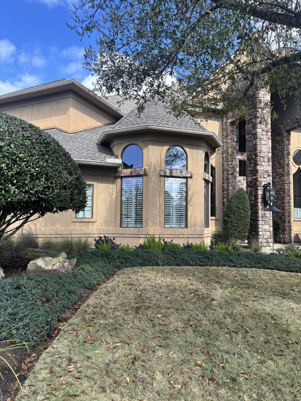 Exterior paint before — stucco facade wide view