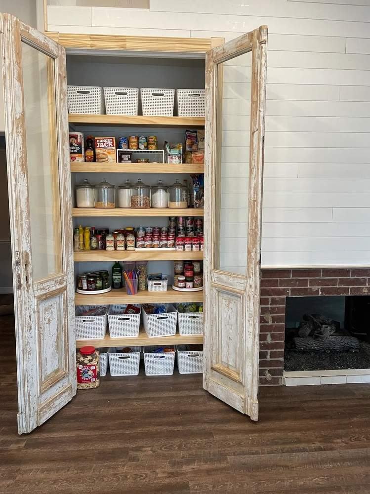 Custom pantry with antique doors by Pomroy Builders Group