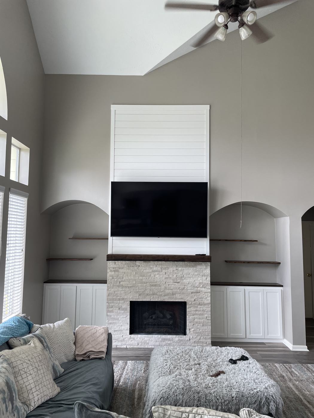 Shiplap accent wall with matching built-in cabinets