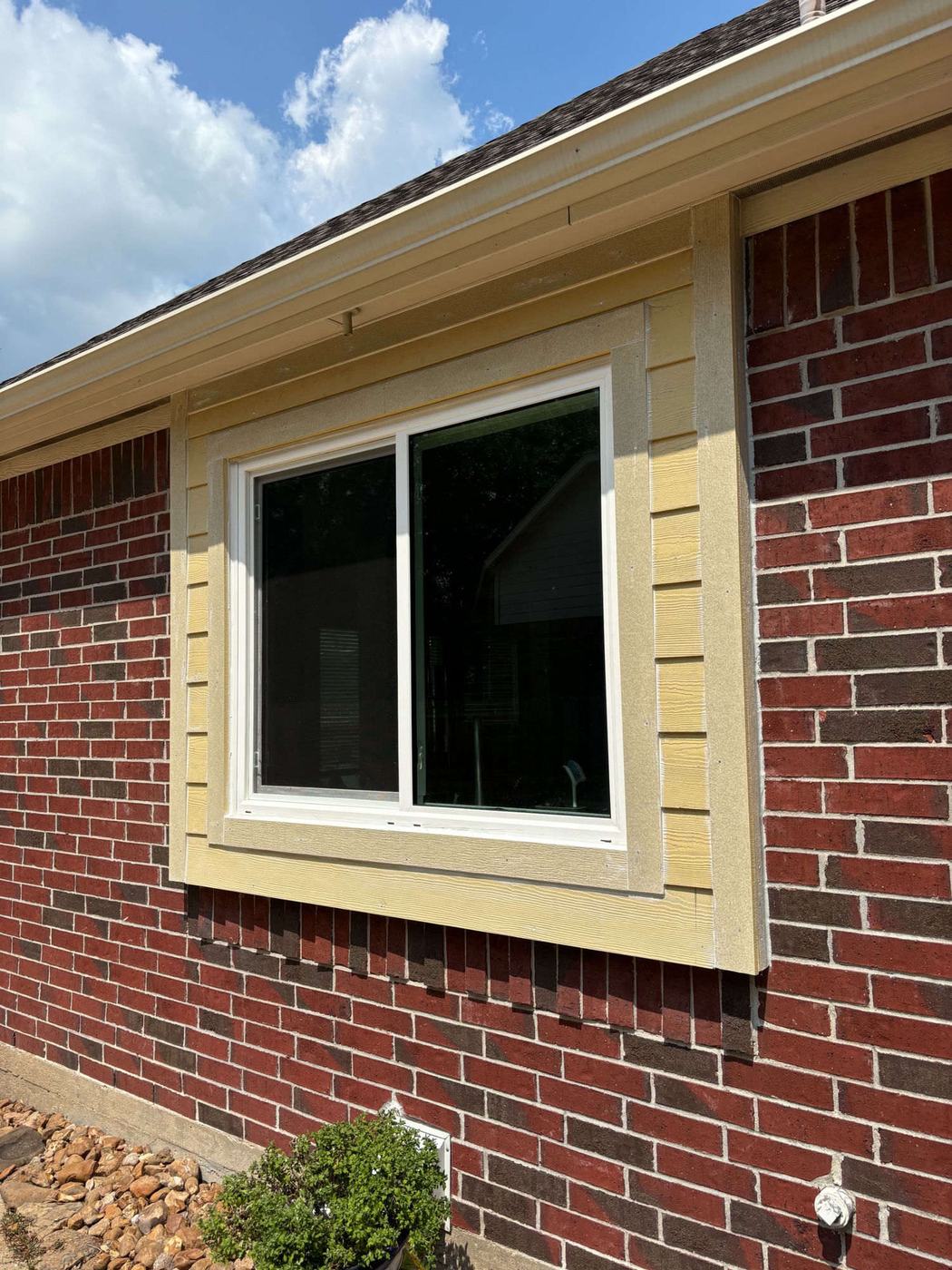 Soffit and siding — finished Hardie trim around window